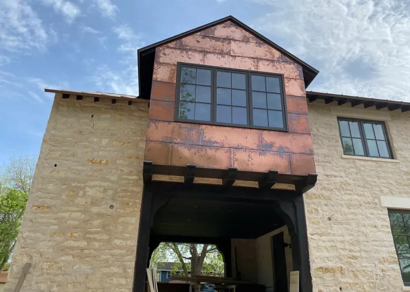 Copper metal panel facade on a stone building for Skylight Installation in Glenn Dale